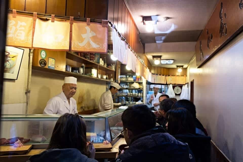 Sushi restaurant in the Tsukiji fish market in Tokyo