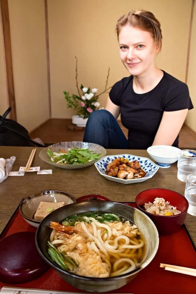 Lunch in a restaurant in Japan with ramen, chicken, rice, tofu, and salad