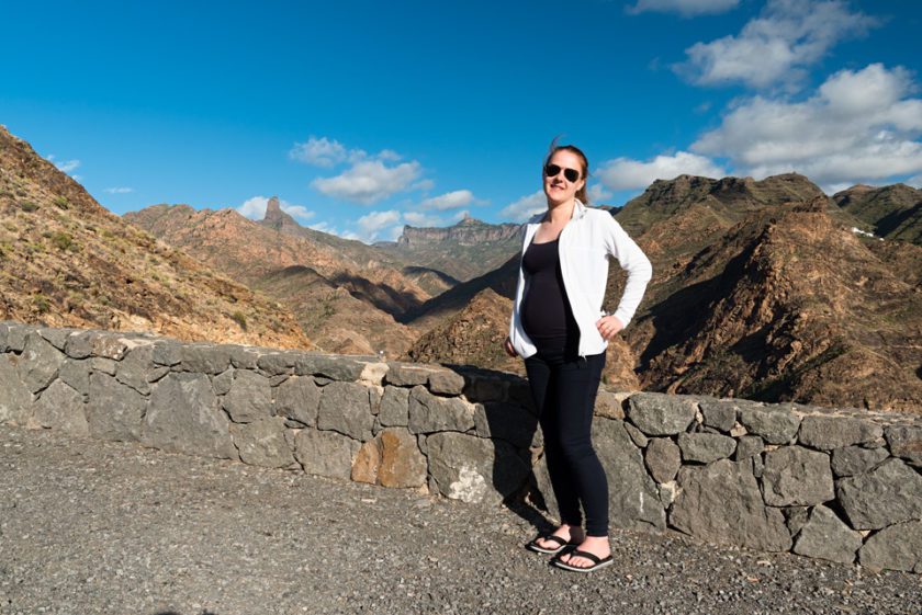 tired pregnant lady in Gran Canaria with mountains in the background