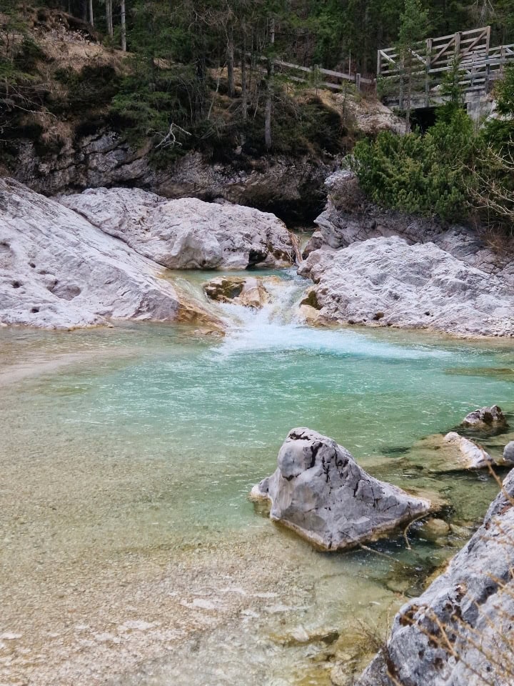 turquoise waterfall in dolomites italy