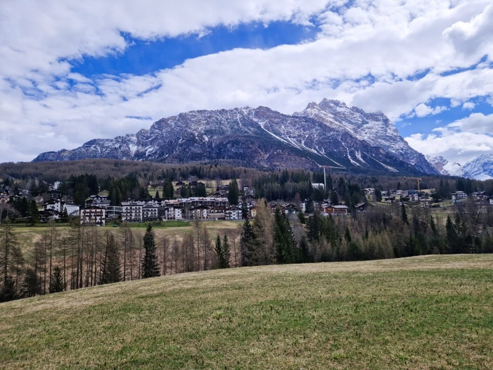 another view of the cortina d'ampezzo and the snowy mountains behind it in dolomites italy