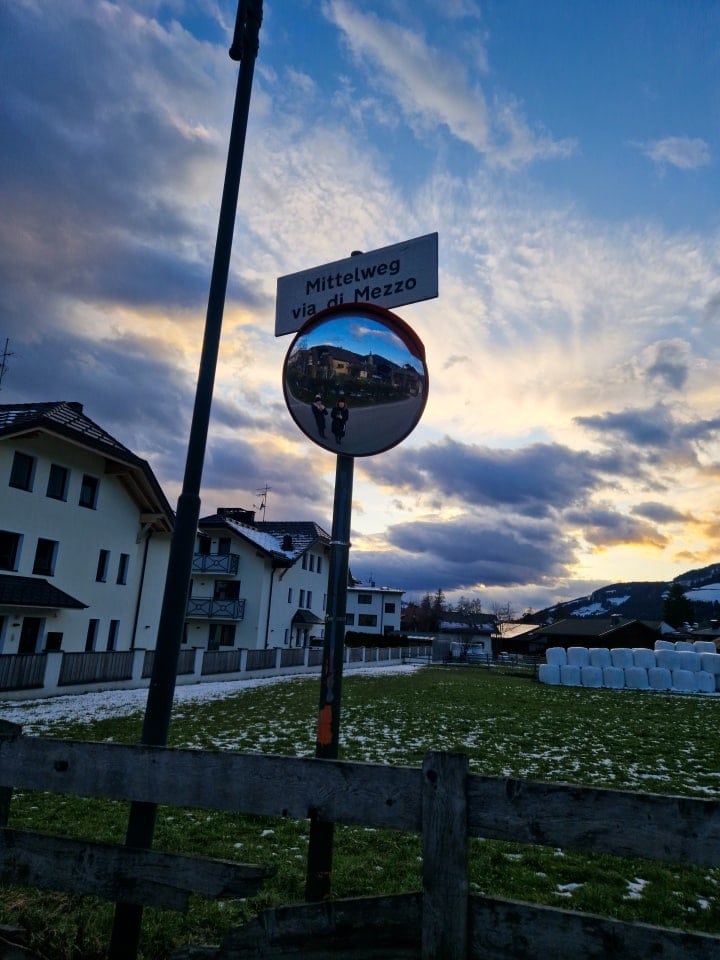 a sunset picture of a street mirror in Dobbiaco Dolomites in Italy