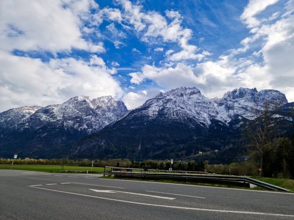 mountains in austria with snow on top of them on the way to the dolomites in italy