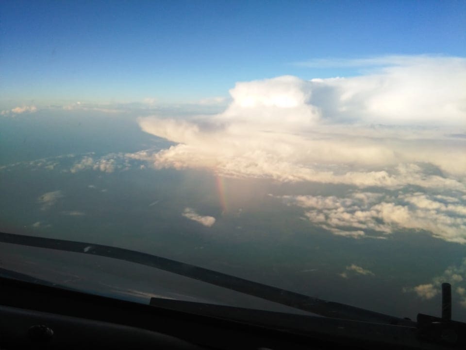 a rainbow seen from a plane's cockpit