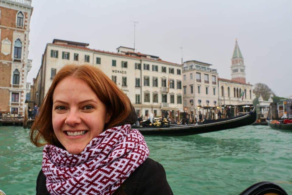 me in a gondola on grand canal in venice in november with monaco & grand canal hotel in the background